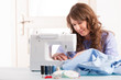 woman using sewing machine