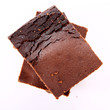 Photo: Slices of a brownie on white background Slices of a brownie on white background