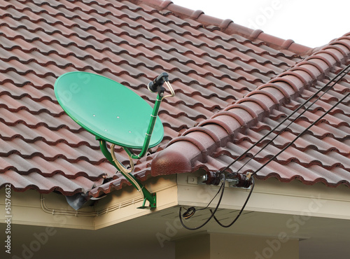 Photo: Satellite dish on the roof of tile Satellite dish on the roof of tile