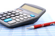 Calculator and pen.