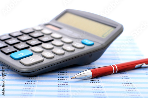 Photo: Calculator and pen. Calculator and pen.