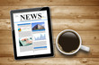 Kaffeetasse mit Tablet Pc und News