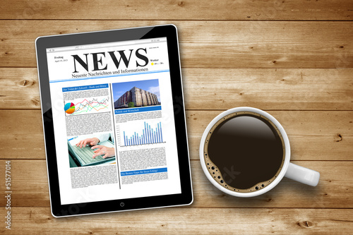 Photo: Kaffeetasse mit Tablet Pc und News Kaffeetasse mit Tablet Pc und News
