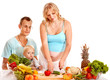 Photo: Family pregnant woman preparing food . Family pregnant woman preparing food .