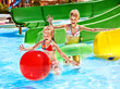 Child on water slide at aquapark.