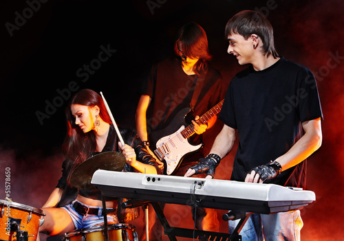Photo: Band playing musical instrument. Band playing musical instrument.