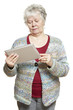 Senior woman using tablet computer looking confused