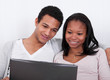 Couple Looking At Laptop
