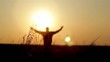 Silhouette of man on the sunrise. Freedom concept.