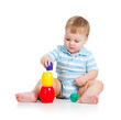 baby boy playing with toys, isolated over white