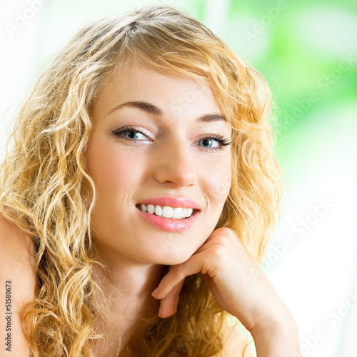Photo: Smiling young beautiful woman, indoors Smiling young beautiful woman, indoors