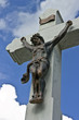 Jesus on the cross with clouds and blue sky in the background