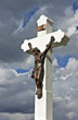 Jesus on the cross with clouds and blue sky in the background