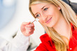 Optometry concept - pretty young woman having her eyes examined