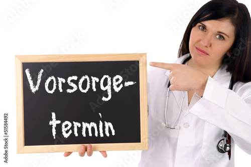 Photo: Ärztin mit Schild - Vorsorgetermin Ärztin mit Schild - Vorsorgetermin