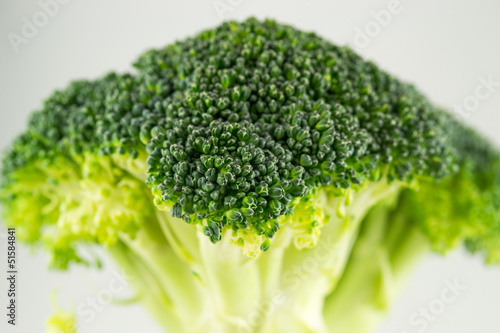 Photo: Fresh raw broccoli isolated on white background Fresh raw broccoli isolated on white background