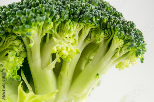 Photo: Fresh raw broccoli isolated on white background Fresh raw broccoli isolated on white background