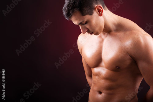 Photo: Healthy muscular young man with beautiful six pack Healthy muscular young man with beautiful six pack