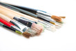 Paint brushes on white background with selective focus
