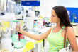 Photo: woman in a shop buying a blender woman in a shop buying a blender