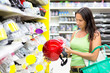 woman buying a motorcycle helmet in the store
