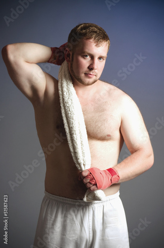 Photo: Portrait of boxer on dark background Portrait of boxer on dark background