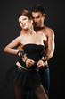 Couple in love. Happy loving couple. Dark background.