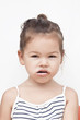 Photo: Asian little girl eating chocolate Asian little girl eating chocolate