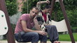 Relationship difficulties, couple on swing, super slow motion
