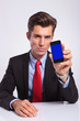 business man shows phone