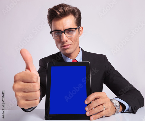 Photo: business man pad thumb up business man pad thumb up
