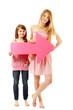 two sisters happy smiling hplding pink arrow