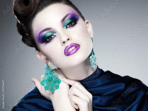 Photo: professional blue make-up and hairstyle on beautiful woman face professional blue make-up and hairstyle on beautiful woman face