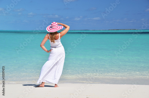Photo: Girl in the hat on the beach of Exuma, Bahamas Girl in the hat on the beach of Exuma, Bahamas