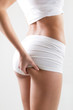 Attractive woman checking cellulite on her but