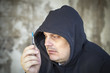 Photo: Drug addict men looks at the syringe in the hands Drug addict men looks at the syringe in the hands