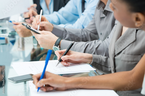 Photo: Business People Writing Note In Meeting Business People Writing Note In Meeting