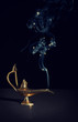 aladdin magic lamp on black with smoke