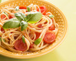 Dish with spaghetti  tomatoes and basil