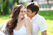 Young love Couple smiling under blue sky