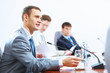 Three businesspeople at meeting