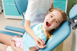 Little girl visiting dentist