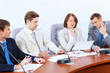 Four businesspeople at meeting