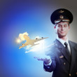 Image of pilot with plane in hand