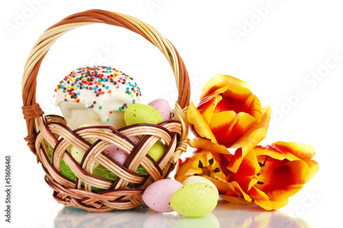 Photo: Easter cake with eggs in wicker basket isolated on white Easter cake with eggs in wicker basket isolated on white