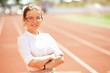 Photo : Business woman sport manager at athletic stadium Business woman sport manager at athletic stadium