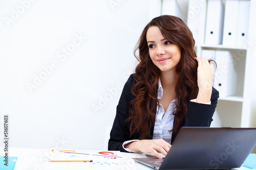 Photo: Young busines woman with notebook Young busines woman with notebook
