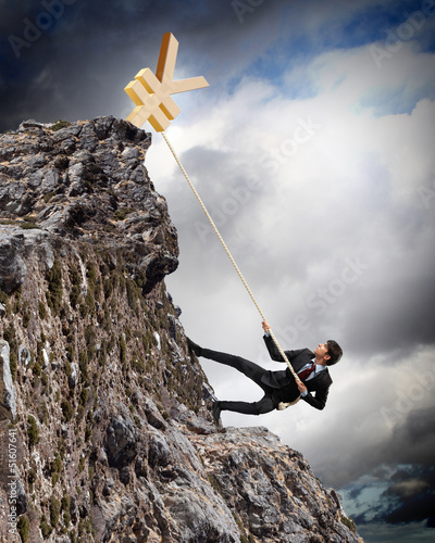 Photo: busiessman climbing mountain busiessman climbing mountain