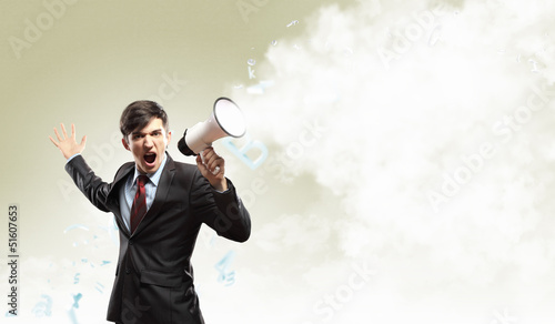 Photo: businessman with megaphone businessman with megaphone