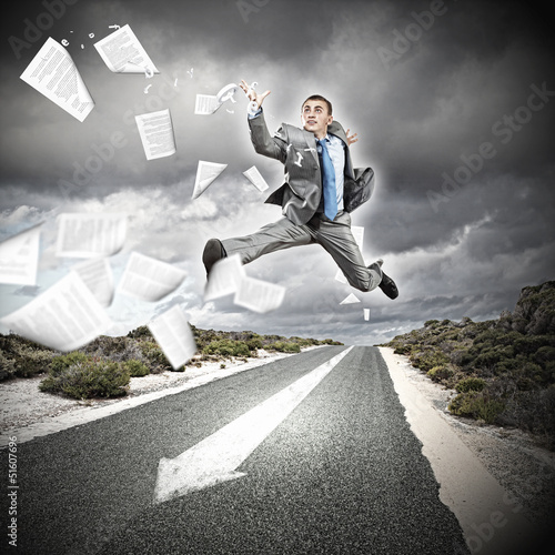 Photo: Businessman running on the road Businessman running on the road